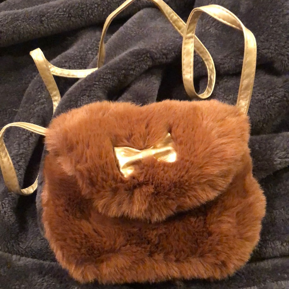 Plush brown purse with a gold bow!